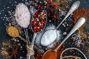 Spoons filled with herbs and spices